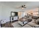 Cozy living room features a ceiling fan, and decorative white storage console and coffee table with black hardware at 398 Benton St, Castle Rock, CO 80104