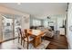 Comfortable living and dining area with hardwood floors, access to outdoor space, and cozy fireplace at 398 Benton St, Castle Rock, CO 80104