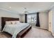 Spacious main bedroom with large window, carpeted floor, and ceiling fan at 398 Benton St, Castle Rock, CO 80104