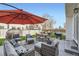 Outdoor patio featuring comfortable seating, a large umbrella, and a grill, perfect for entertaining at 398 Benton St, Castle Rock, CO 80104