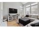 Bright living room featuring high ceilings, hardwood floors and neutral color palette at 4733 Flower St, Wheat Ridge, CO 80033