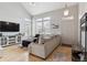 Bright living room featuring high ceilings, hardwood floors and neutral color palette at 4733 Flower St, Wheat Ridge, CO 80033