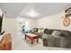 Basement features a comfortable living area and adjacent exercise space at 6662 Fonder Dr, Parker, CO 80134