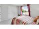 Bedroom features natural light, neutral tones, and double-door closet at 6662 Fonder Dr, Parker, CO 80134