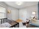 This bright Bedroom is spacious, featuring hardwood floors, a rocking chair, and two closets at 6662 Fonder Dr, Parker, CO 80134