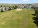 Wide shot of the community area showcasing green space, pool, and baseball field at 6662 Fonder Dr, Parker, CO 80134