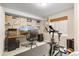 Finished basement exercise room with mounted TV and workout equipment at 6662 Fonder Dr, Parker, CO 80134