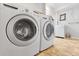 Laundry room features updated machines and functional layout at 6662 Fonder Dr, Parker, CO 80134