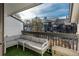 Private balcony with cushioned seating and a view of the neighborhood at 532 Oakwood Dr # D202, Castle Rock, CO 80104