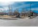 Exterior view of the community with mature trees and mountain views at 532 Oakwood Dr # D202, Castle Rock, CO 80104