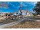 Landscaped exterior featuring community garden boxes and sidewalks at 532 Oakwood Dr # D202, Castle Rock, CO 80104