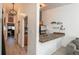 Hallway leading to a kitchen with tile countertops, stainless appliances and cabinetry at 532 Oakwood Dr # D202, Castle Rock, CO 80104