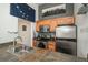 Modern kitchen with stainless steel appliances, wood cabinets, and tile countertops at 532 Oakwood Dr # D202, Castle Rock, CO 80104