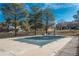 Outdoor pool covered for the off-season surrounded by mature trees at 532 Oakwood Dr # D202, Castle Rock, CO 80104