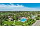 Aerial view featuring a large community pool, park and nearby homes at 24031 E Hinsdale Pl, Aurora, CO 80016