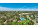 Aerial view featuring a large community pool, park and nearby homes at 24031 E Hinsdale Pl, Aurora, CO 80016