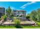 Beautiful backyard with mature trees and tiered landscaping at 24031 E Hinsdale Pl, Aurora, CO 80016