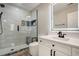 Bathroom featuring a large glass shower with a bench, a toilet, and a vanity with an LED mirror at 24031 E Hinsdale Pl, Aurora, CO 80016