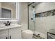 Bathroom with a sink vanity, a large LED mirror, a toilet, and a glass shower at 24031 E Hinsdale Pl, Aurora, CO 80016