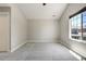 Bedroom with neutral walls, plush carpeting, a window, and a white door at 24031 E Hinsdale Pl, Aurora, CO 80016