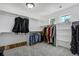 Spacious walk-in closet with custom shelving, hanging racks, and plenty of storage for an organized wardrobe at 24031 E Hinsdale Pl, Aurora, CO 80016
