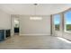 Bright dining area featuring modern light fixture, white cabinets, and bar with wine cooler at 24031 E Hinsdale Pl, Aurora, CO 80016