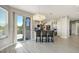 Open kitchen with an island, stainless steel appliances, and access to a deck at 24031 E Hinsdale Pl, Aurora, CO 80016