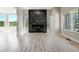 Spacious living room featuring a modern fireplace and bright, airy space at 24031 E Hinsdale Pl, Aurora, CO 80016