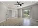 Bright living room with light wood floors, neutral paint, and a large window with natural light at 24031 E Hinsdale Pl, Aurora, CO 80016