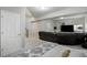 Spacious living room with a large sectional sofa and natural light at 24031 E Hinsdale Pl, Aurora, CO 80016