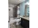 Cozy bathroom featuring tiled walls, decorative accents, and a glass vessel sink at 14962 Williams St, Thornton, CO 80602