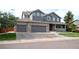 Charming two-story home featuring a three-car garage and a welcoming front porch at 14962 Williams St, Thornton, CO 80602