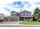Charming two-story home featuring a three-car garage and a welcoming front porch at 14962 Williams St, Thornton, CO 80602
