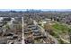 An aerial view shows the property in a quiet neighborhood with city views and mature trees at 4780 Pennsylvania St, Denver, CO 80216