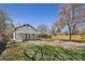 Back of home with good sized backyard and wood fence at 4780 Pennsylvania St, Denver, CO 80216