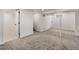 Spacious finished basement with neutral carpet and white walls, recessed lighting, and multiple rooms at 4780 Pennsylvania St, Denver, CO 80216
