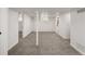 Finished basement with neutral carpet and walls, recessed lighting, and multiple rooms at 4780 Pennsylvania St, Denver, CO 80216