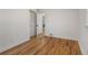 Empty bedroom featuring hardwood floors and neutral walls with a bright window at 4780 Pennsylvania St, Denver, CO 80216