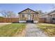 Charming home featuring a covered porch, a well-manicured lawn, and a pathway leading to the front door at 4780 Pennsylvania St, Denver, CO 80216
