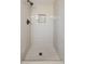 Newly renovated shower with gray subway tile and mosaic tile floor at 4780 Pennsylvania St, Denver, CO 80216