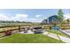 Enjoy the backyard with lush turf, fire pit, and a playful area at 4918 Preserve Pl, Firestone, CO 80504