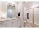Modern bathroom with white cabinets, shower, and stylish finishes at 4918 Preserve Pl, Firestone, CO 80504