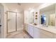 Contemporary bathroom with double sinks, a shower, and stylish fixtures at 4918 Preserve Pl, Firestone, CO 80504