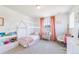 Cute bedroom with pastel accents and a whimsical bed frame at 4918 Preserve Pl, Firestone, CO 80504