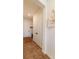 Entryway with storage closet, exterior door, light-colored walls and modern flooring at 4918 Preserve Pl, Firestone, CO 80504