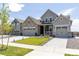 Charming two-story home featuring stone accents, well-manicured lawn, and an inviting entrance at 4918 Preserve Pl, Firestone, CO 80504