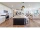 Open-concept kitchen and living area with a large island, perfect for entertaining at 4918 Preserve Pl, Firestone, CO 80504