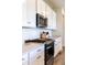 Modern kitchen featuring sleek appliances, ample counter space, and abundant storage at 4918 Preserve Pl, Firestone, CO 80504
