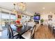 Open concept living room with modern fireplace, comfortable seating, and lots of natural light at 4918 Preserve Pl, Firestone, CO 80504