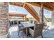 Entertain easily in this outdoor kitchen with stone surround, grill, outdoor dining and playground at 4918 Preserve Pl, Firestone, CO 80504